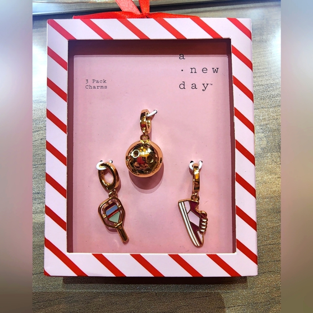 A New Day Gold Charm Set.            *BRAND NEW IN BOX*